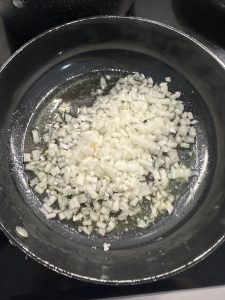 onions cooking in a pan