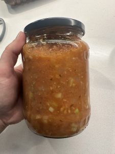 salsa added to a sterilised jar