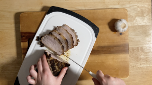 slicing the pork roast after it rested for 10-15 mins